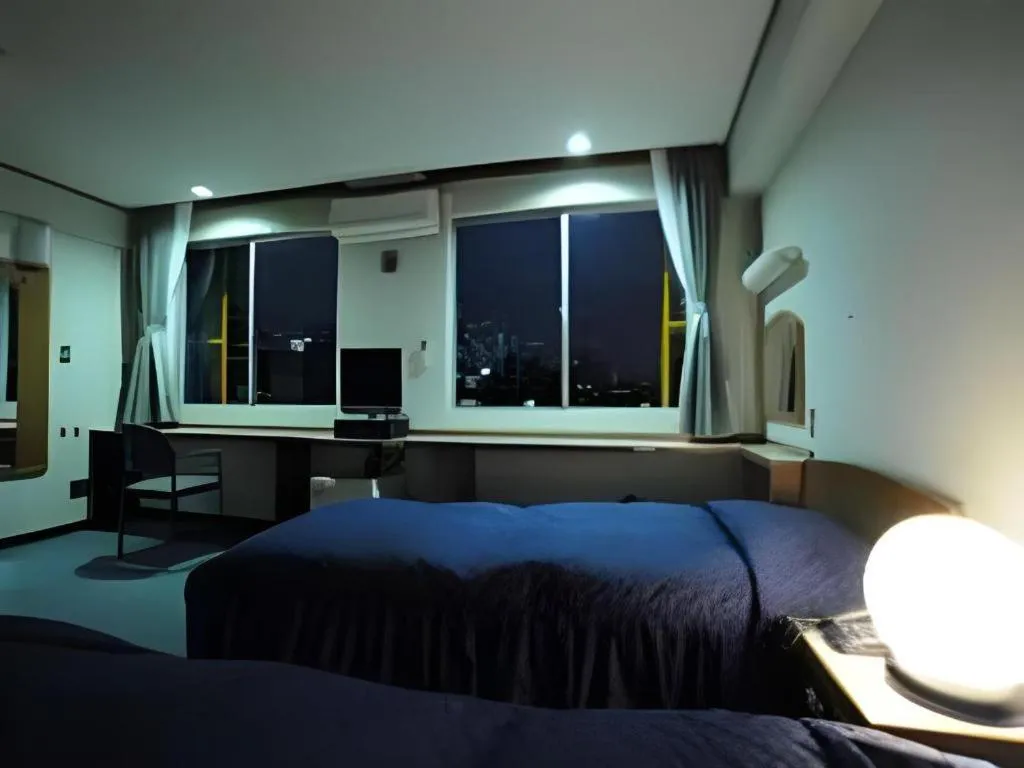 Bed in Tokyo Business Hotel