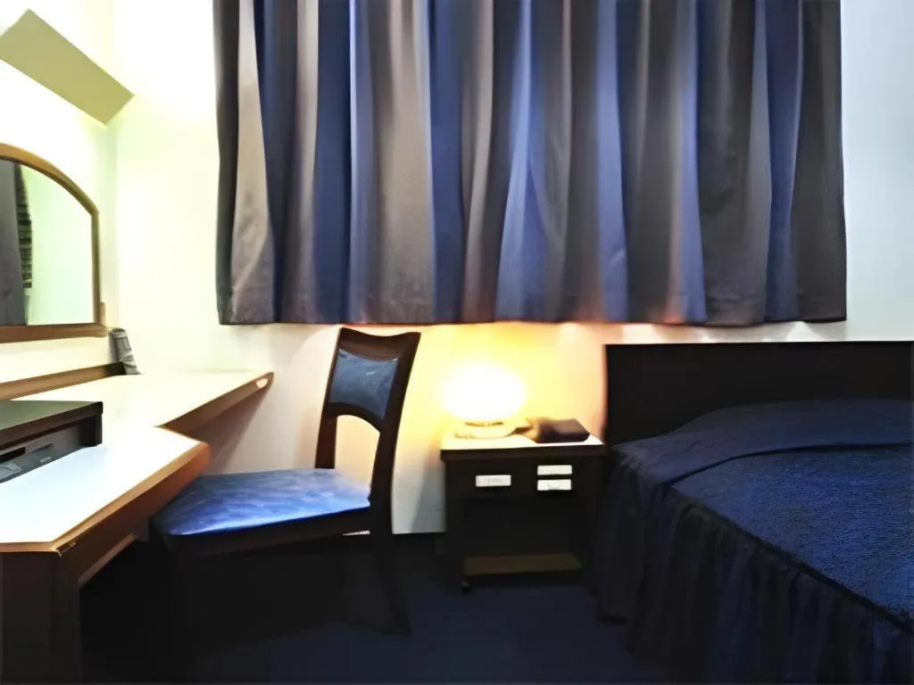 Bed in Tokyo Business Hotel