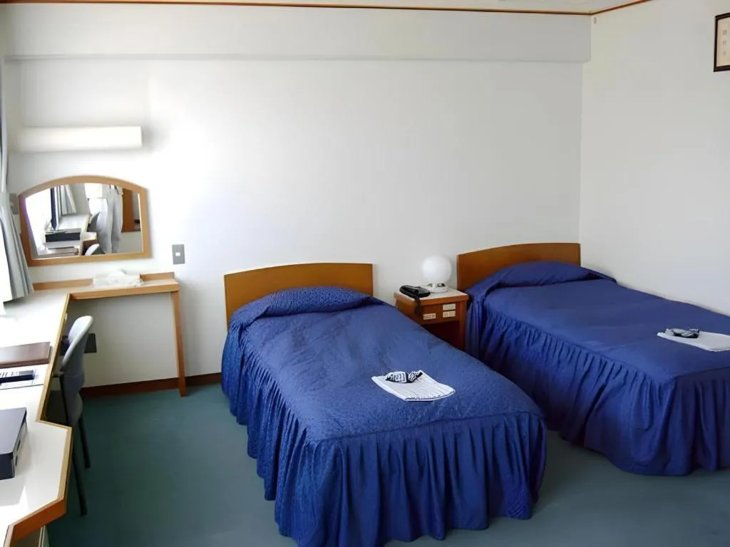 Bed in Tokyo Business Hotel