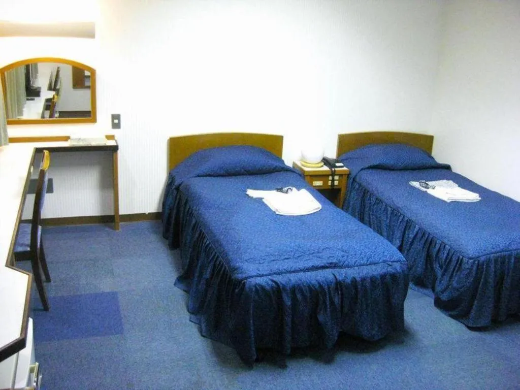 Bed in Tokyo Business Hotel