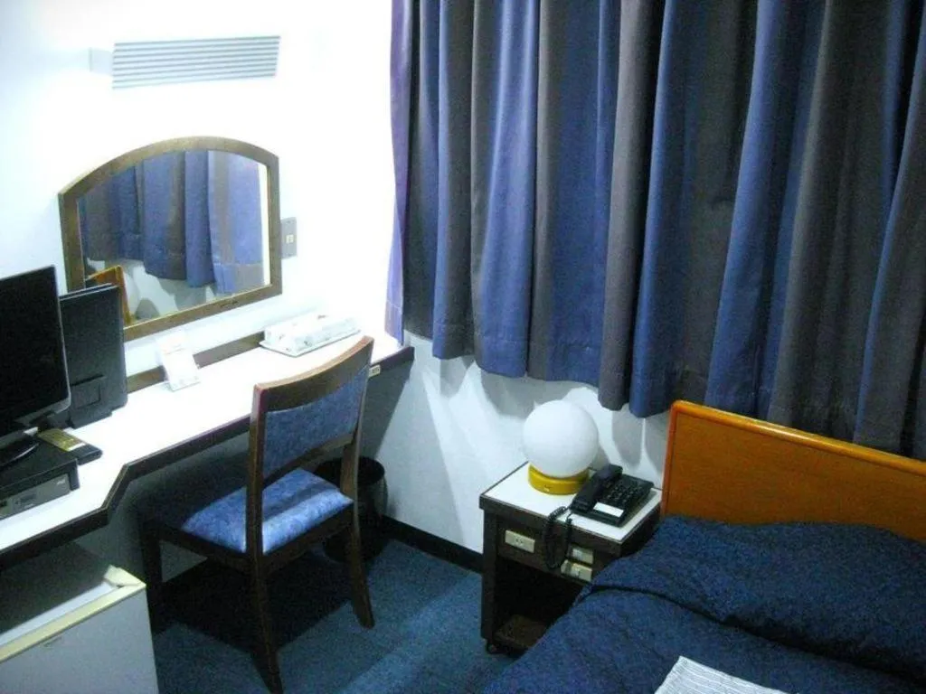 Bed in Tokyo Business Hotel