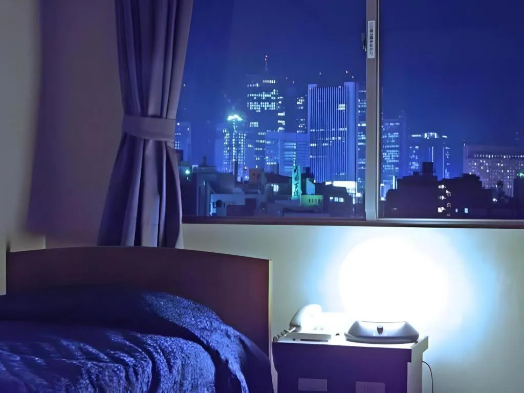 Bed in Tokyo Business Hotel