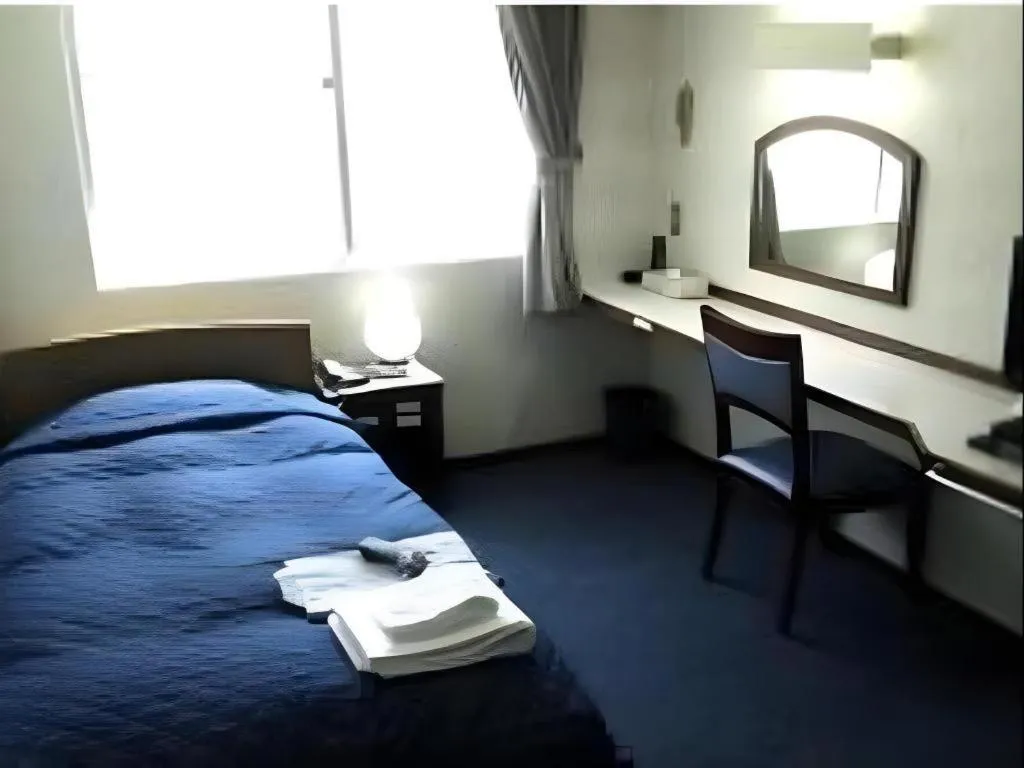 Bed in Tokyo Business Hotel