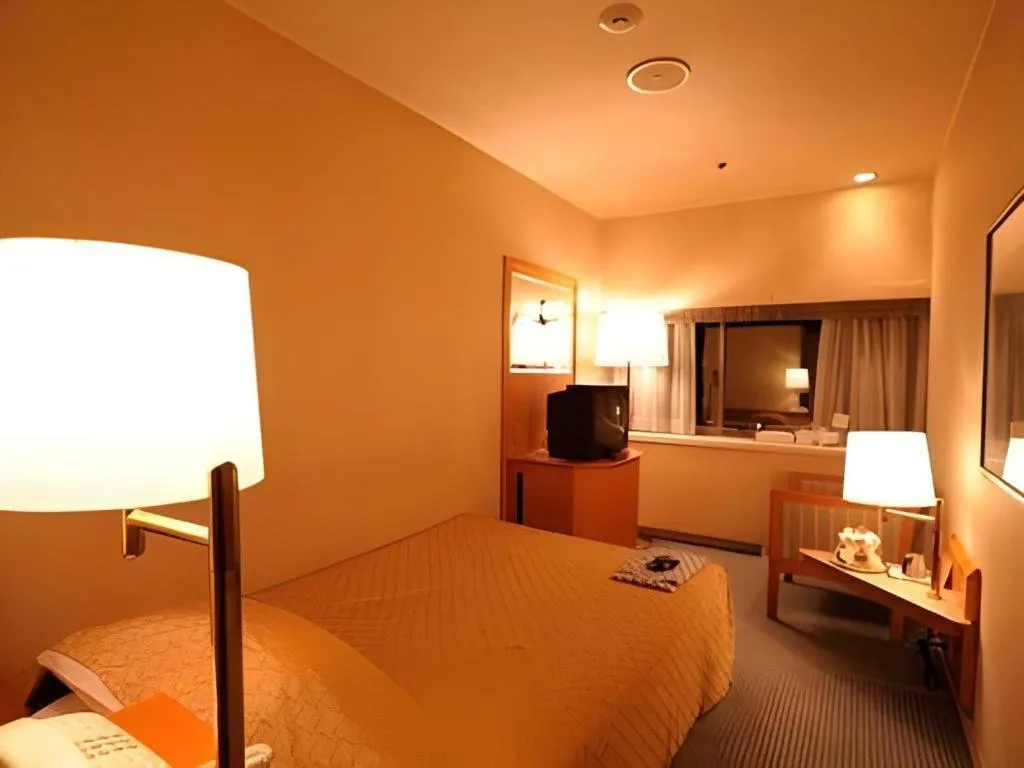 Bed in Gunma Royal Hotel