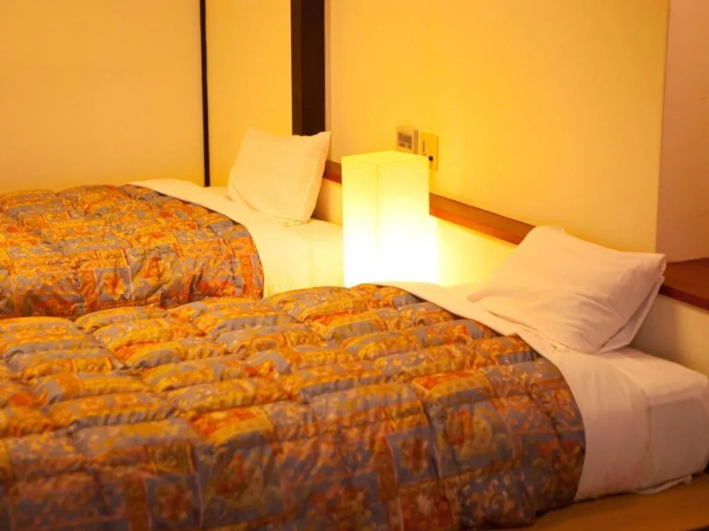 Bed in Kannawa Onsen Hotel Sansuikan