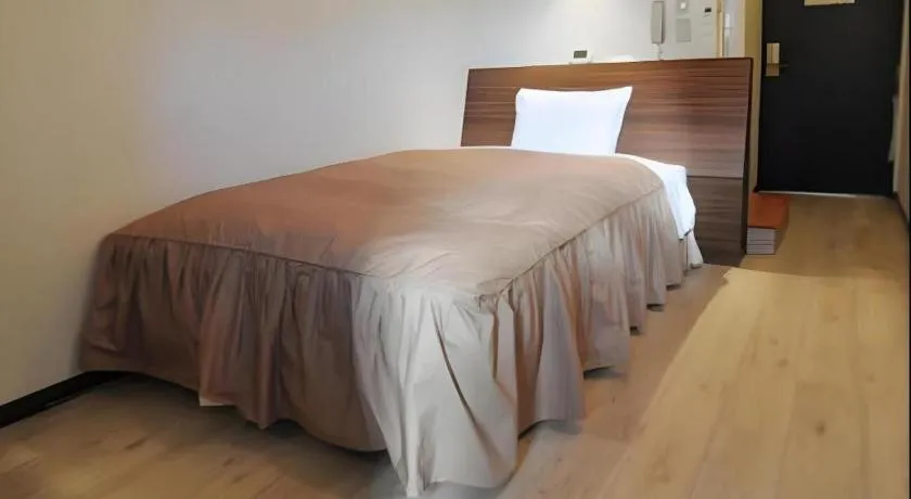 Bed in Hotel Tetora Tsurumi