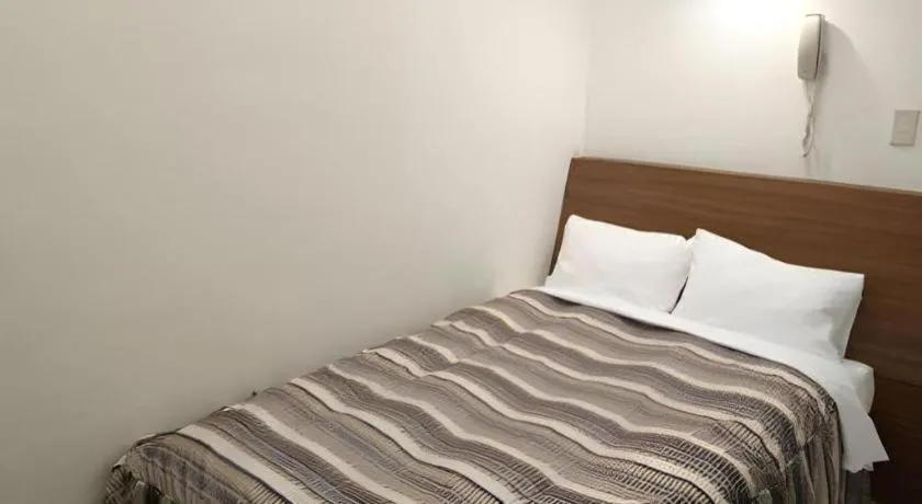 Bed in Hotel Tetora Tsurumi