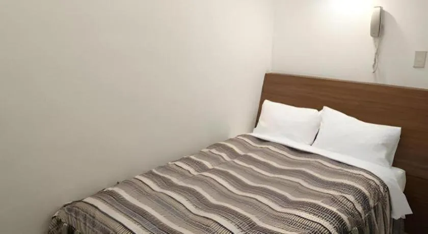 Bed in Hotel Tetora Tsurumi