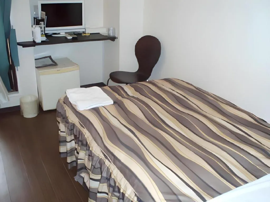 Bed in Hotel Tetora Tsurumi