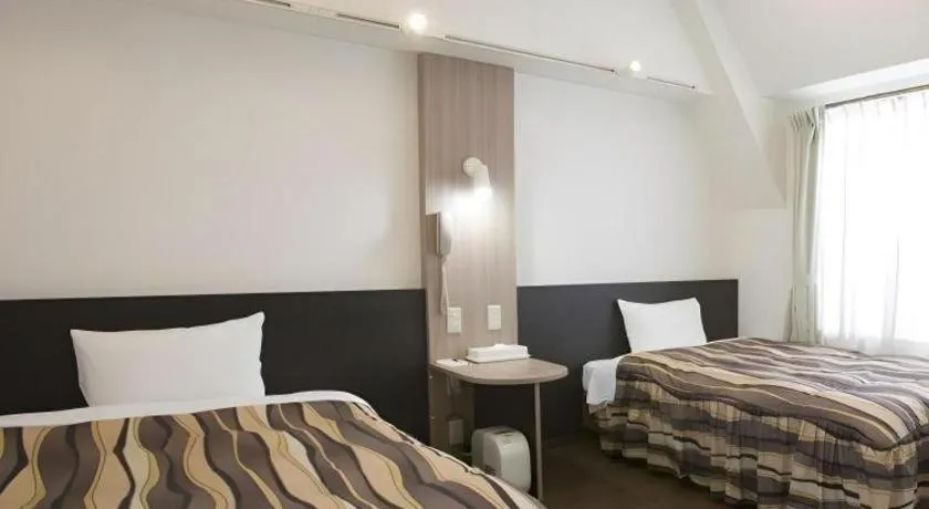 Bed in Hotel Tetora Tsurumi