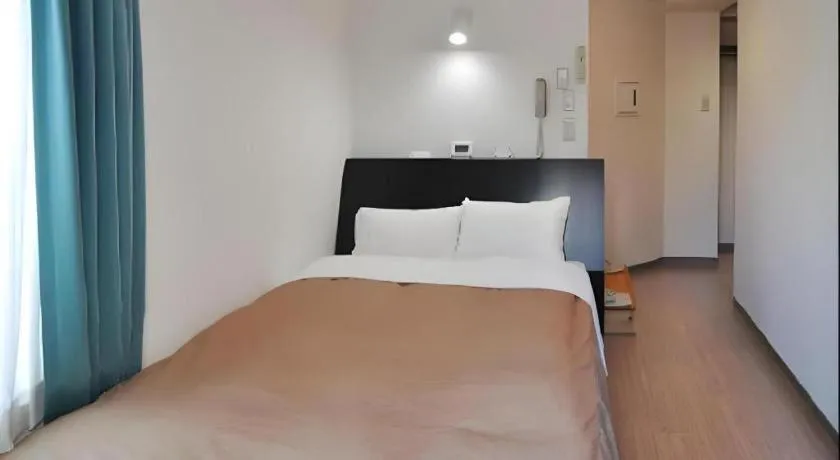 Bed in Hotel Tetora Tsurumi