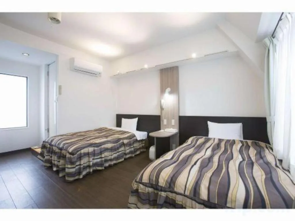 Bed in Hotel Tetora Tsurumi