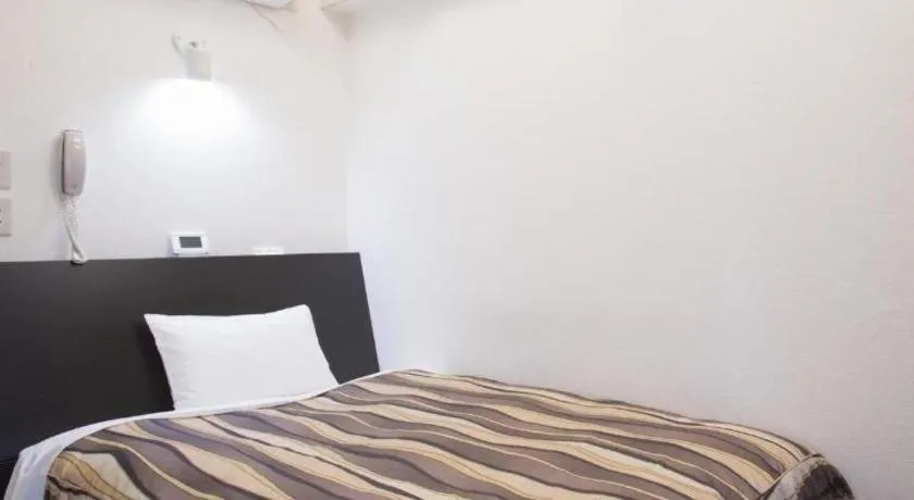 Bed in Hotel Tetora Tsurumi