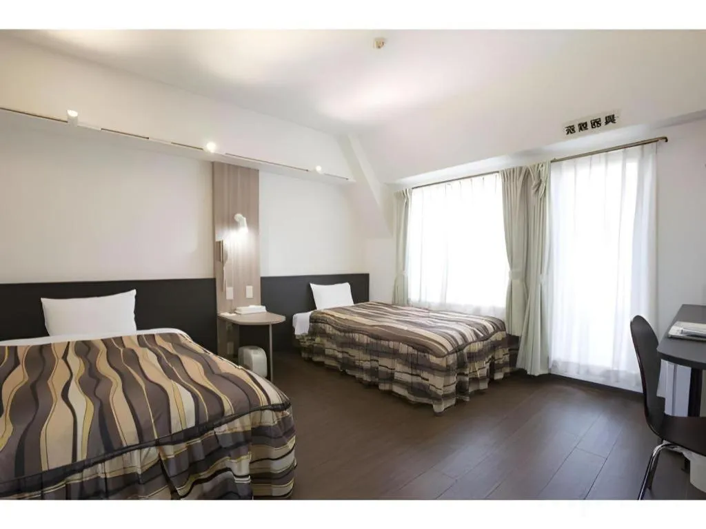 Bed in Hotel Tetora Tsurumi