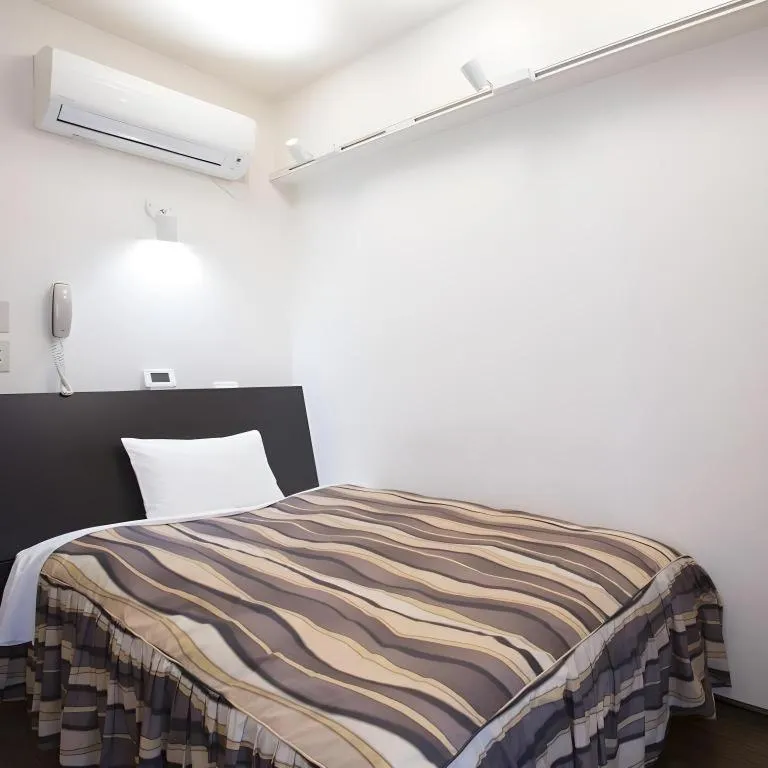 Bed in Hotel Tetora Tsurumi