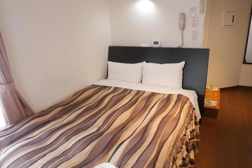 Bed in Hotel Tetora Tsurumi