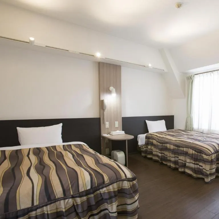 Bed in Hotel Tetora Tsurumi