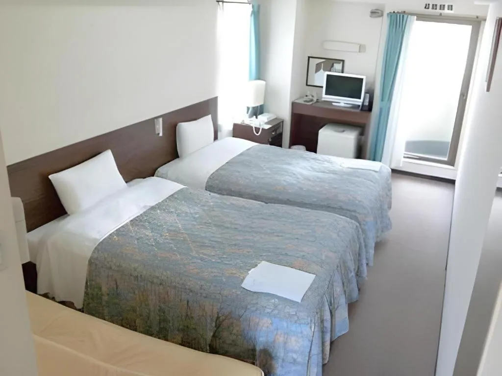 Bed in Hotel Tetora Tsurumi