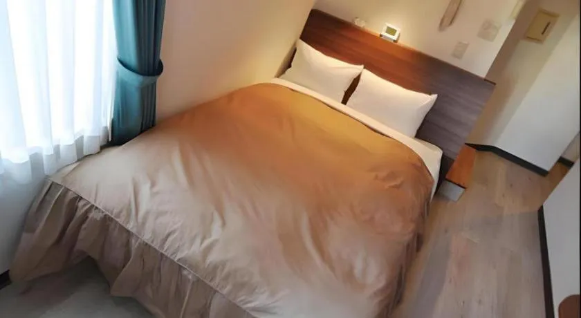 Bed in Hotel Tetora Tsurumi