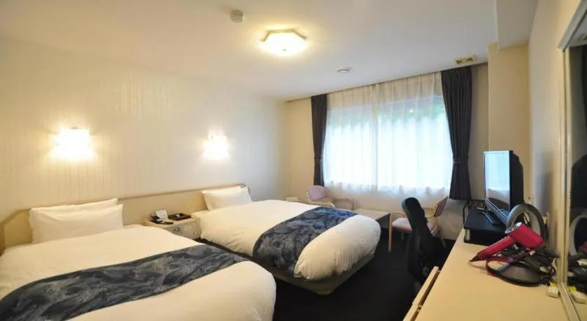 Bed in Hotel Obokekyo Mannaka