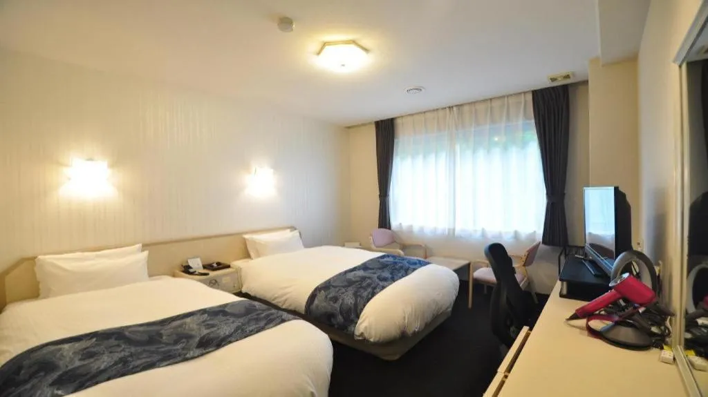 Bed in Hotel Obokekyo Mannaka