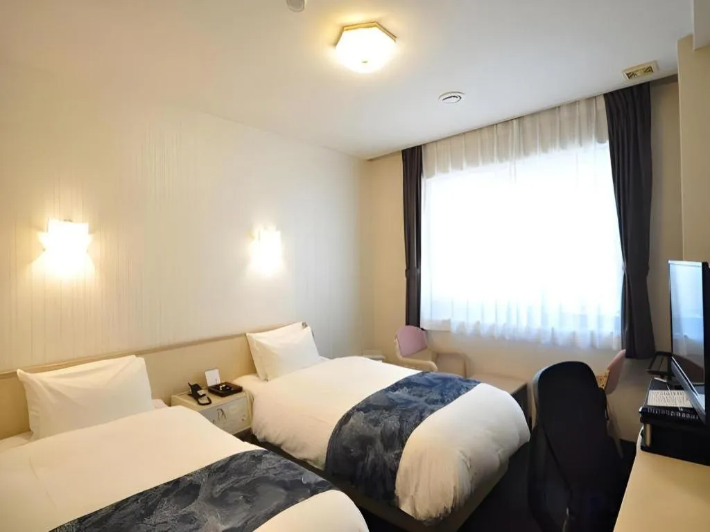 Bed in Hotel Obokekyo Mannaka