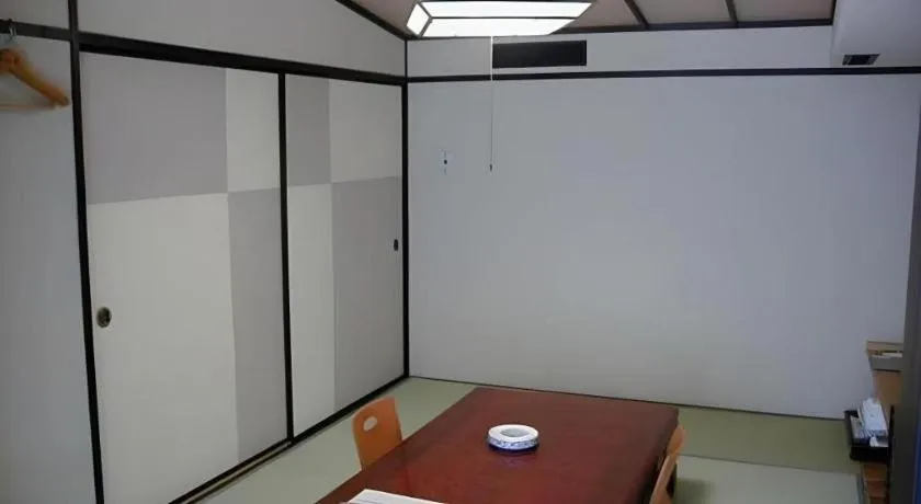 Bed in Hotel Myoken Tanaka Kaikan