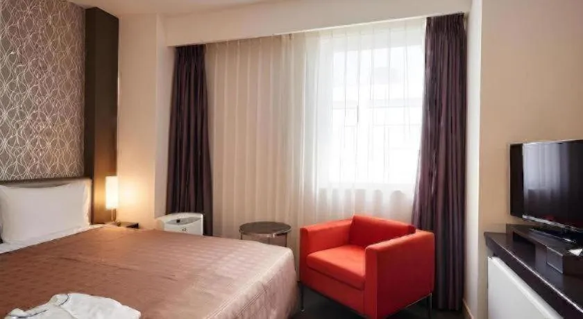 Bed in Hotel Yuquesta Asahibashi