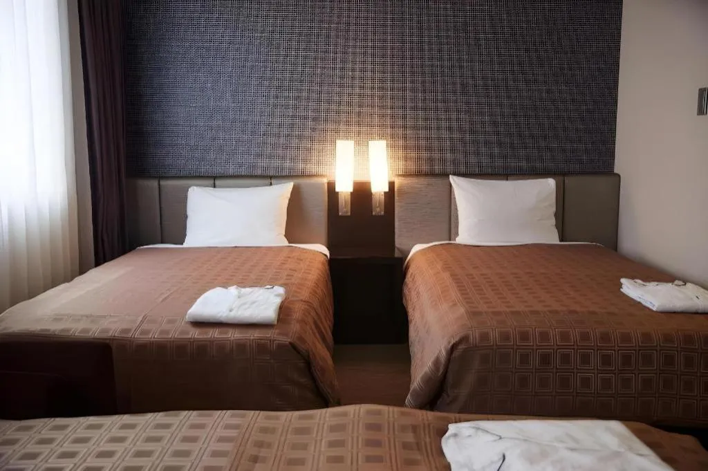 Bed in Hotel Yuquesta Asahibashi