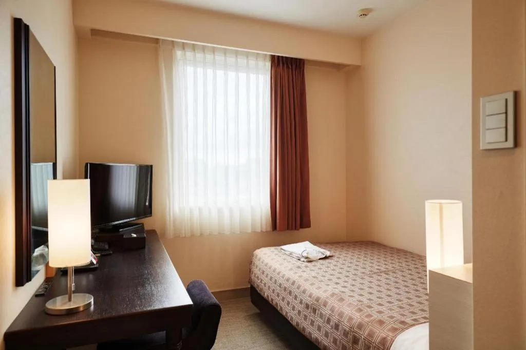 Bed in Hotel Yuquesta Asahibashi