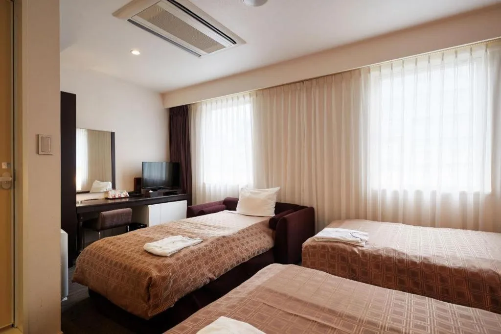 Bed in Hotel Yuquesta Asahibashi