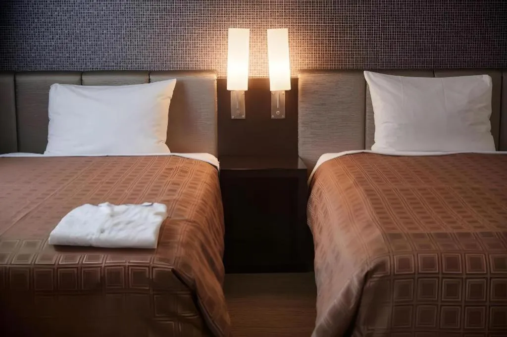 Bed in Hotel Yuquesta Asahibashi