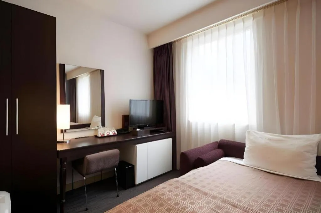 Bed in Hotel Yuquesta Asahibashi