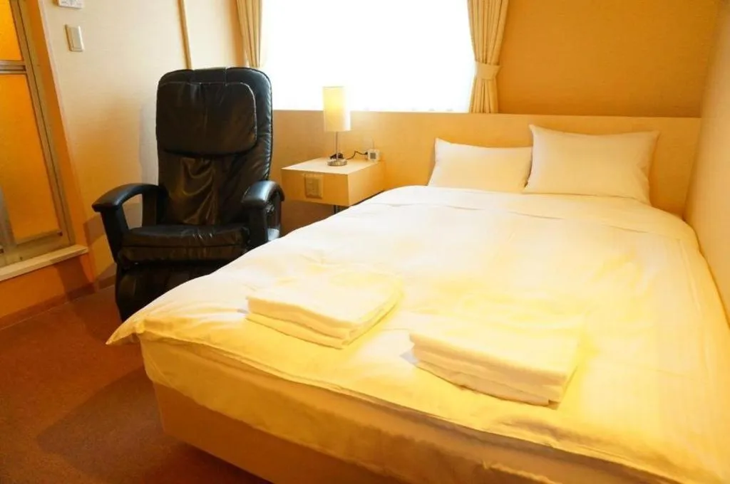 Bed in Hotel The Grand Court Matsusaka