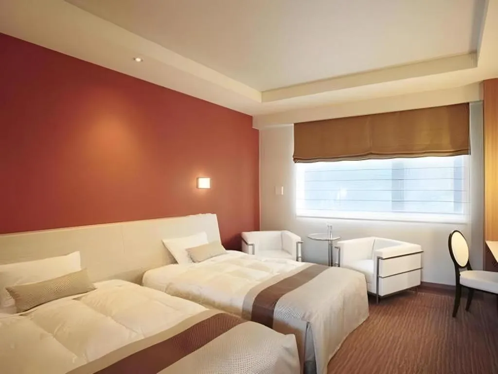 Bed in Sakuraan Kawaguchiko Hotel