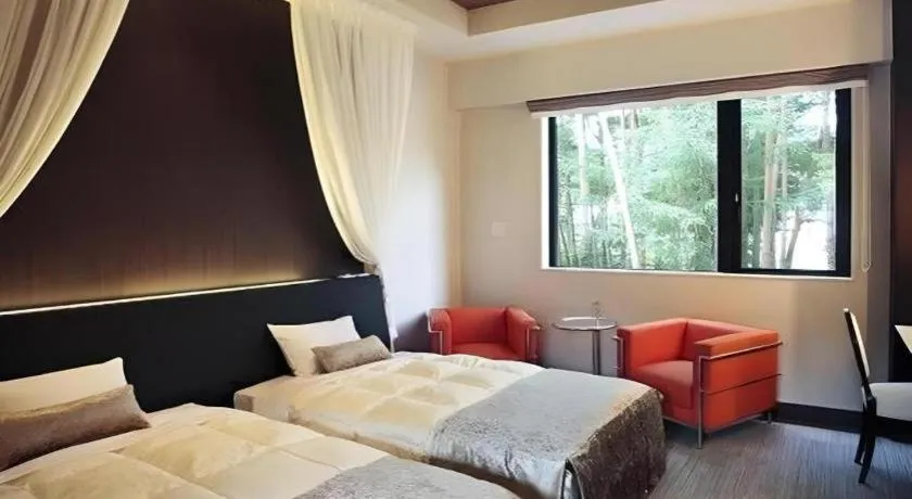 Bed in Sakuraan Kawaguchiko Hotel