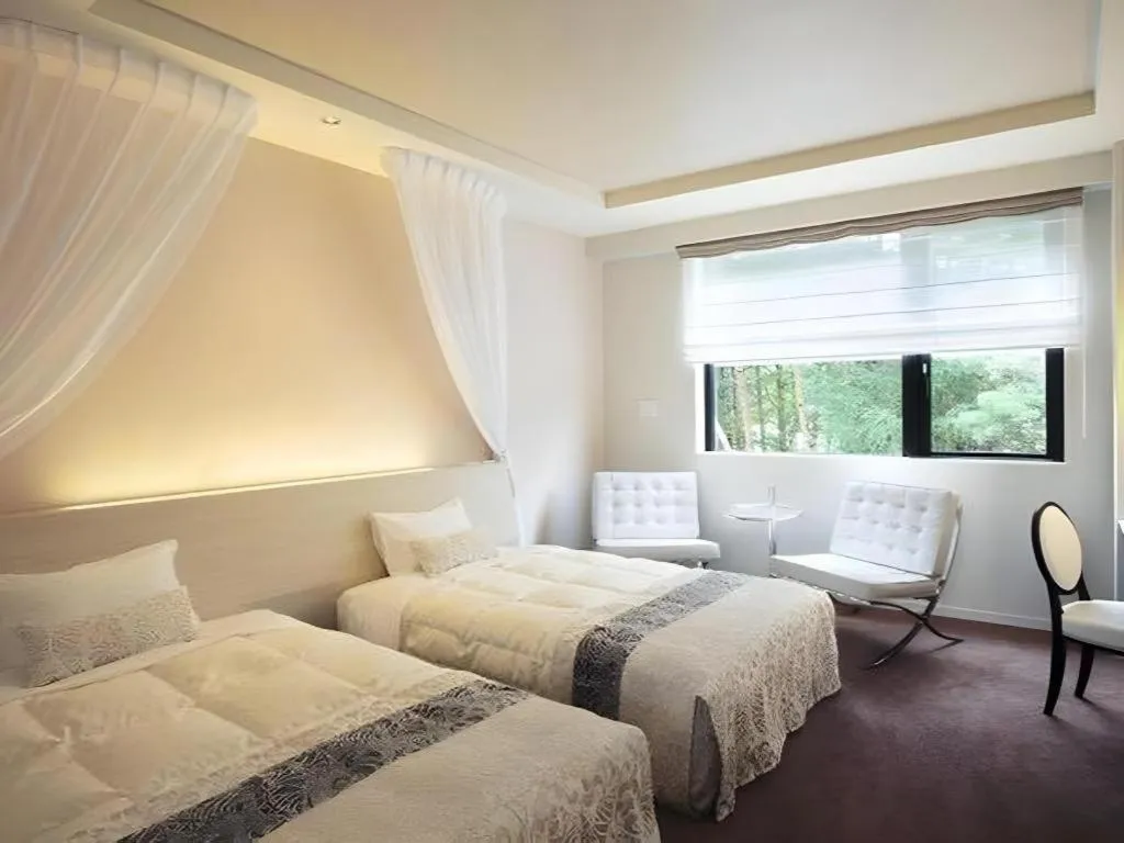 Bed in Sakuraan Kawaguchiko Hotel