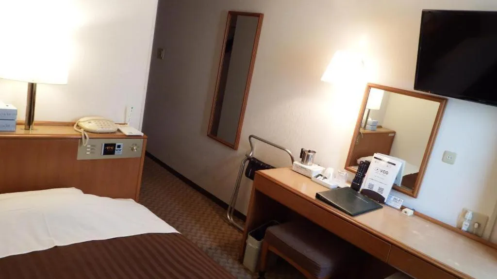 Bed in Mizue Dai-ichi Hotel