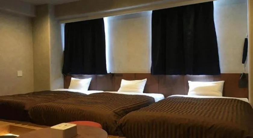 Bed in Mizue Dai-ichi Hotel