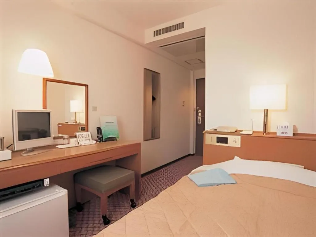 Bed in Mizue Dai-ichi Hotel