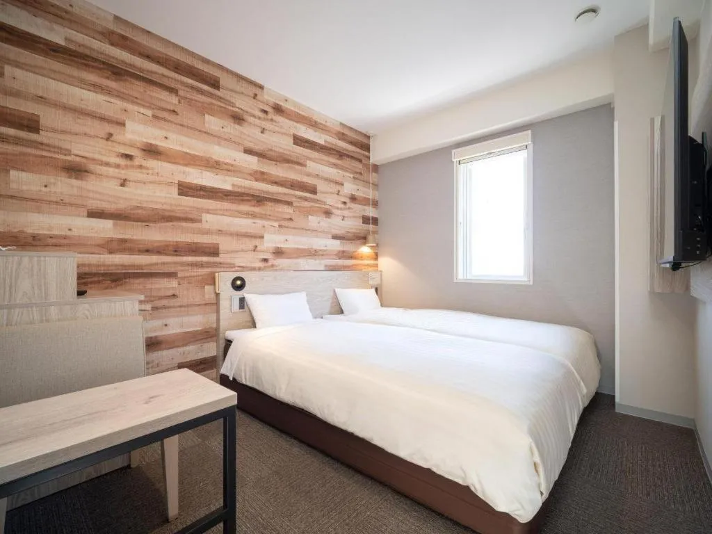 Bed in Super Hotel Hakodate