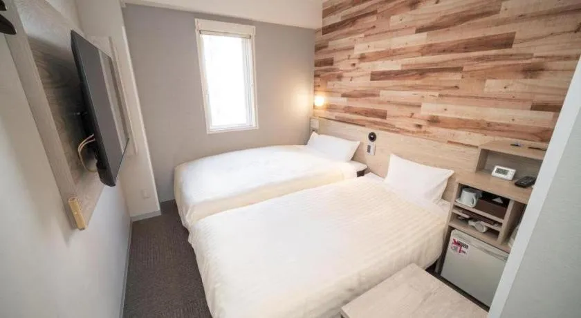 Bed in Super Hotel Hakodate