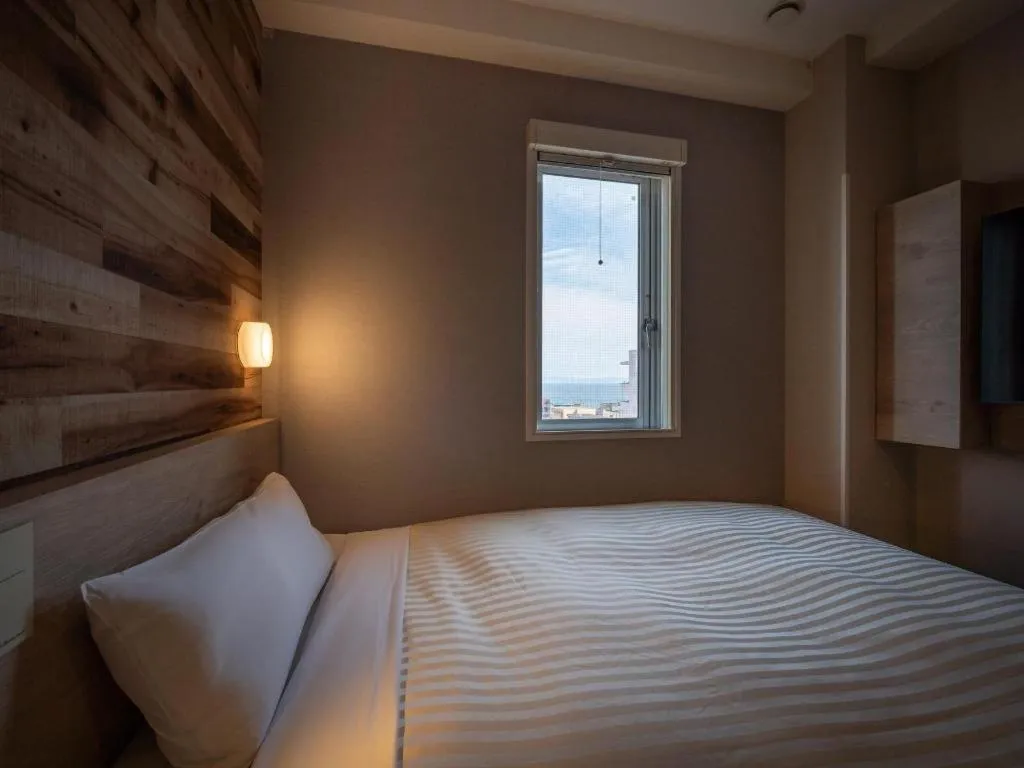 Bed in Super Hotel Hakodate