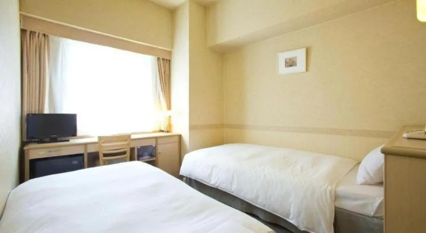 Bed in Hotel South Garden Hamamatsu