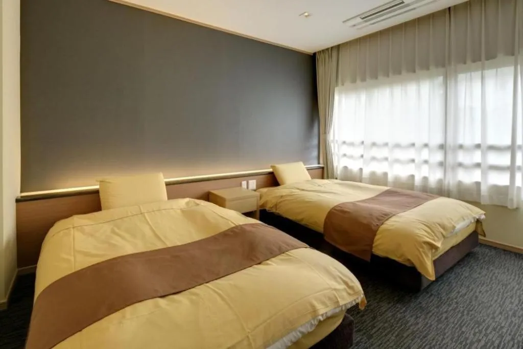 Bed in Yugawara Mizu No Kaori Hotel
