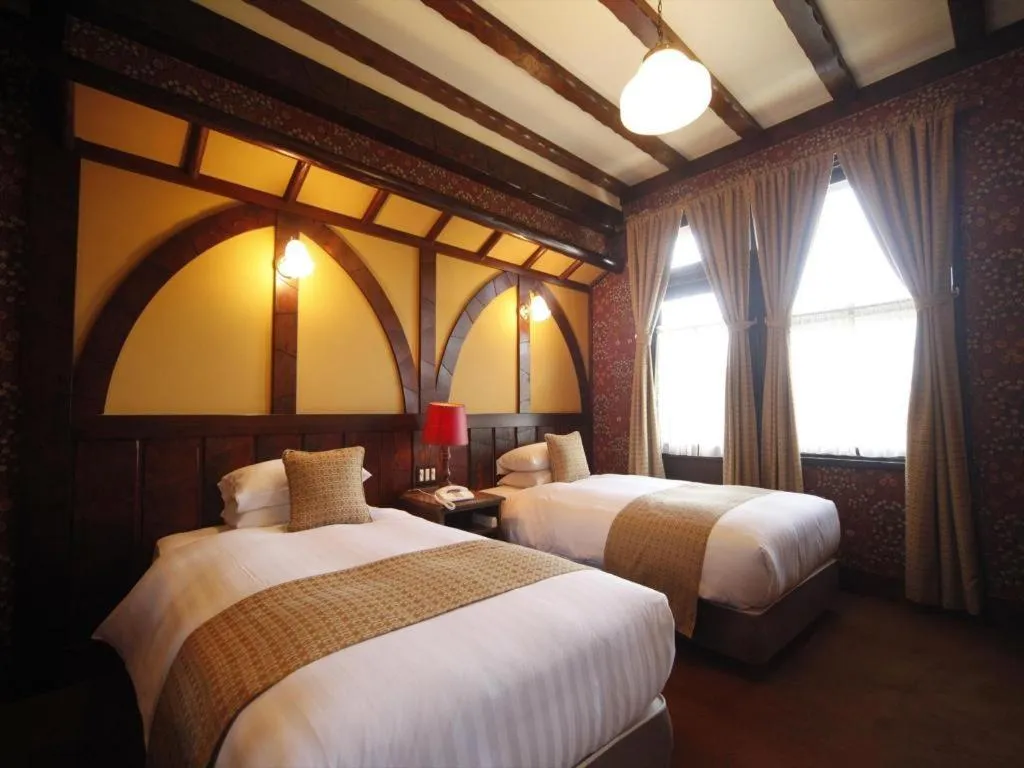 Bed in Unzen Kanko Hotel