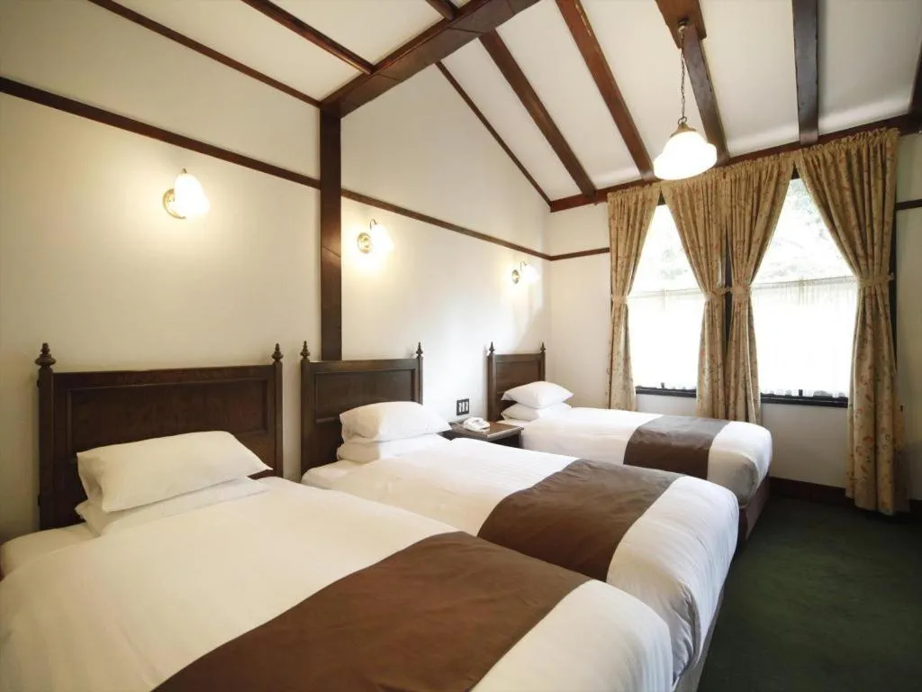 Bed in Unzen Kanko Hotel