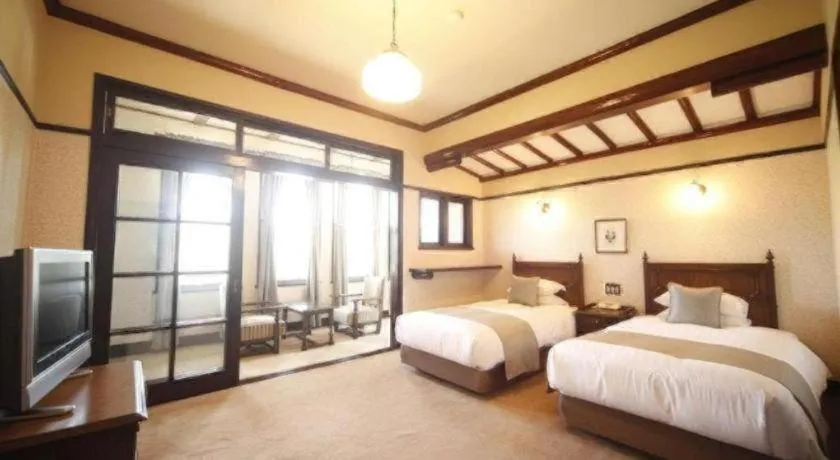 Bed in Unzen Kanko Hotel