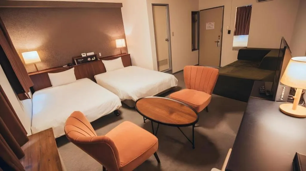 Bed in Hotel AreaOne Miyazaki City