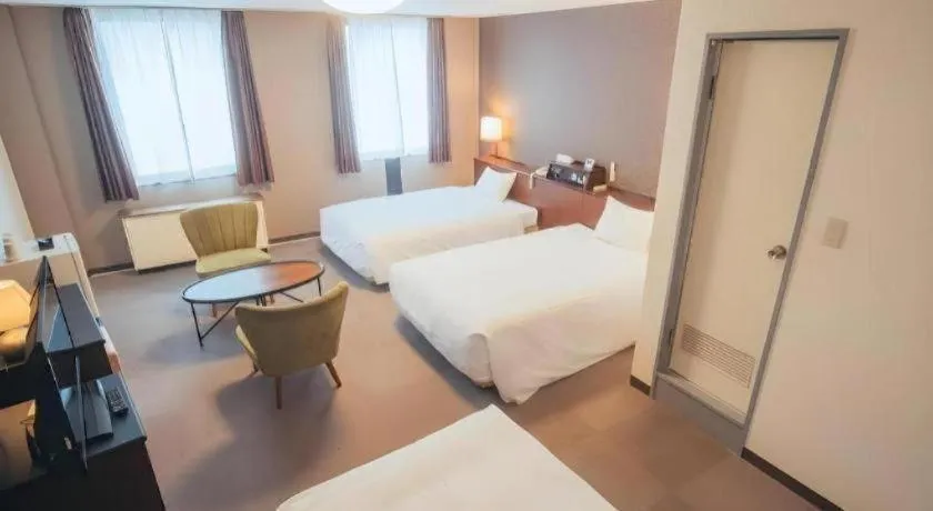 Bed in Hotel AreaOne Miyazaki City